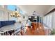 Spacious living room with fireplace, vaulted ceilings, and natural light at 3639 Darston St, Palm Harbor, FL 34685