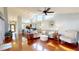 Open-concept living space with hardwood floors, comfortable seating, and large windows at 3639 Darston St, Palm Harbor, FL 34685