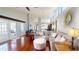 Bright living room with hardwood floors, comfortable seating, and a view of the dining area at 3639 Darston St, Palm Harbor, FL 34685