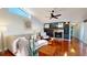 Cozy living room with fireplace, ceiling fan, and hardwood flooring at 3639 Darston St, Palm Harbor, FL 34685