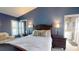 Relaxing main bedroom with ensuite bathroom, ample closet space, and plantation shutters at 3639 Darston St, Palm Harbor, FL 34685