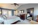 A bright, spacious main bedroom with a ceiling fan and a mirror at 3639 Darston St, Palm Harbor, FL 34685