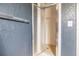 Bathroom features a shower with glass doors, neutral tiling, and a convenient towel rack at 401 Apache Trl, Brandon, FL 33511