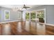 Bright bedroom with sliding doors leading to a screened patio and pool area at 401 Apache Trl, Brandon, FL 33511