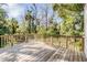 Wood deck overlooks the beautiful surrounding landscape with natural beauty and privacy at 401 Apache Trl, Brandon, FL 33511