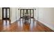 Dining room with hardwood floors and doors that let in lots of natural light at 401 Apache Trl, Brandon, FL 33511