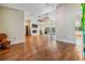Spacious living room with hardwood floors, vaulted ceiling, and a cozy fireplace at 401 Apache Trl, Brandon, FL 33511