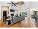 Spacious living room with hardwood floors, fireplace, and access to the pool area at 401 Apache Trl, Brandon, FL 33511