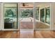 View from the home's interior shows a screened-in patio with brick and a lovely pool outside at 401 Apache Trl, Brandon, FL 33511