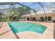 Inviting pool area featuring a screened enclosure and ample space for lounging and recreation at 401 Apache Trl, Brandon, FL 33511