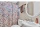 Bathroom with white sink and toilet, featuring a shower curtain at 427 5Th Nw St, Largo, FL 33770