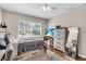 Bedroom featuring a bed with drawers and a large window at 427 5Th Nw St, Largo, FL 33770