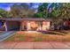 Charming single-story home featuring a cozy front porch and well-maintained lawn at 427 5Th Nw St, Largo, FL 33770