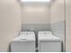 A laundry room featuring a pair of washing machines at 427 5Th Nw St, Largo, FL 33770