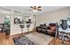 Open-concept living area with bar seating that connects to the kitchen; hardwood floors at 427 5Th Nw St, Largo, FL 33770