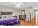 Comfortable main bedroom featuring hardwood floors and neutral decor at 427 5Th Nw St, Largo, FL 33770