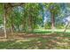 Expansive green space with mature trees and a well-maintained grassy area at 427 5Th Nw St, Largo, FL 33770