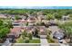 Aerial view of a charming single-Gathering home, showcasing its well-manicured lawn and established landscaping in a quiet neighborhood at 4426 Brandon Ridge Dr, Valrico, FL 33594