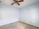 Carpeted bedroom featuring a ceiling fan, blank blue walls, and electrical outlets at 4426 Brandon Ridge Dr, Valrico, FL 33594