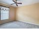 Bedroom with carpet flooring, a window with blinds and curtains and a ceiling fan at 4426 Brandon Ridge Dr, Valrico, FL 33594