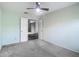 Bedroom with double door leading into another room, neutral walls, ceiling fan at 4426 Brandon Ridge Dr, Valrico, FL 33594