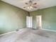 Spacious bedroom with carpeted floors and a ceiling fan at 4426 Brandon Ridge Dr, Valrico, FL 33594