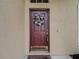 Close-up of the front door with decorative wreath, sidelight, and 'No Soliciting' sign at 4426 Brandon Ridge Dr, Valrico, FL 33594