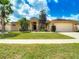 Lovely single-story home with manicured lawn and landscaping under a beautiful blue sky at 4426 Brandon Ridge Dr, Valrico, FL 33594
