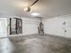 Spacious two-car garage with water heater, furnace, and ample room for storage or parking, and an access door to outside at 4426 Brandon Ridge Dr, Valrico, FL 33594