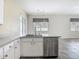 Well-lit kitchen with stainless steel appliances, plenty of counter space, and natural light at 4426 Brandon Ridge Dr, Valrico, FL 33594