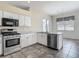 Updated kitchen with stainless steel appliances and white cabinetry at 4426 Brandon Ridge Dr, Valrico, FL 33594