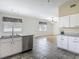 Open kitchen and living room with stainless steel appliances, tile floors, and natural light at 4426 Brandon Ridge Dr, Valrico, FL 33594