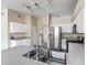 Bright kitchen features white cabinets, stainless steel appliances, and a modern faucet and sink at 4426 Brandon Ridge Dr, Valrico, FL 33594