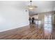 Spacious living room features hardwood floors and a view into the kitchen at 4426 Brandon Ridge Dr, Valrico, FL 33594
