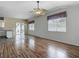Bright living room features hardwood floors and windows allowing lots of natural light at 4426 Brandon Ridge Dr, Valrico, FL 33594
