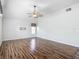 An inviting living room features hard wood floors and neutral paint at 4426 Brandon Ridge Dr, Valrico, FL 33594