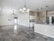 An open concept living room and kitchen features hard wood floors and great lighting at 4426 Brandon Ridge Dr, Valrico, FL 33594