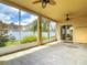 Screened-in patio featuring ceiling fans with backyard views at 4426 Brandon Ridge Dr, Valrico, FL 33594