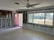 Spacious living room with exposed framework ready for customizations and renovations at 447 80Th Ave, St Pete Beach, FL 33706