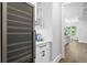 Features a wine cooler and custom cabinets with white countertops and hardware at 4614 W Lowell Ave, Tampa, FL 33629
