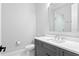 Modern bathroom with a gray vanity and stylish fixtures at 4614 W Lowell Ave, Tampa, FL 33629