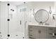 Modern bathroom with a glass enclosed shower, elegant vanity, and stylish fixtures at 4614 W Lowell Ave, Tampa, FL 33629