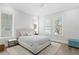 Cozy bedroom with natural light, neutral tones, and a comfortable bed at 4614 W Lowell Ave, Tampa, FL 33629