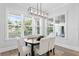 The breakfast nook features bright windows and a modern chandelier at 4614 W Lowell Ave, Tampa, FL 33629