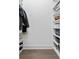 A well-organized closet with shelves, hanging racks, and storage for shoes and accessories at 4614 W Lowell Ave, Tampa, FL 33629