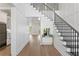 Elegant foyer with high ceilings, hardwood floors, and a staircase with iron railings at 4614 W Lowell Ave, Tampa, FL 33629