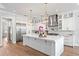 Spacious kitchen with a large center island, stainless steel appliances, and modern lighting at 4614 W Lowell Ave, Tampa, FL 33629