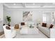 Bright living room features coffered ceilings, neutral decor, and stylish furnishings at 4614 W Lowell Ave, Tampa, FL 33629