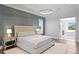 Elegant main bedroom featuring natural light, wood flooring, and access to a luxurious en-suite bathroom at 4614 W Lowell Ave, Tampa, FL 33629