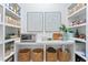 Walk-in pantry with custom shelving, cabinets, and a marble countertop at 4614 W Lowell Ave, Tampa, FL 33629
